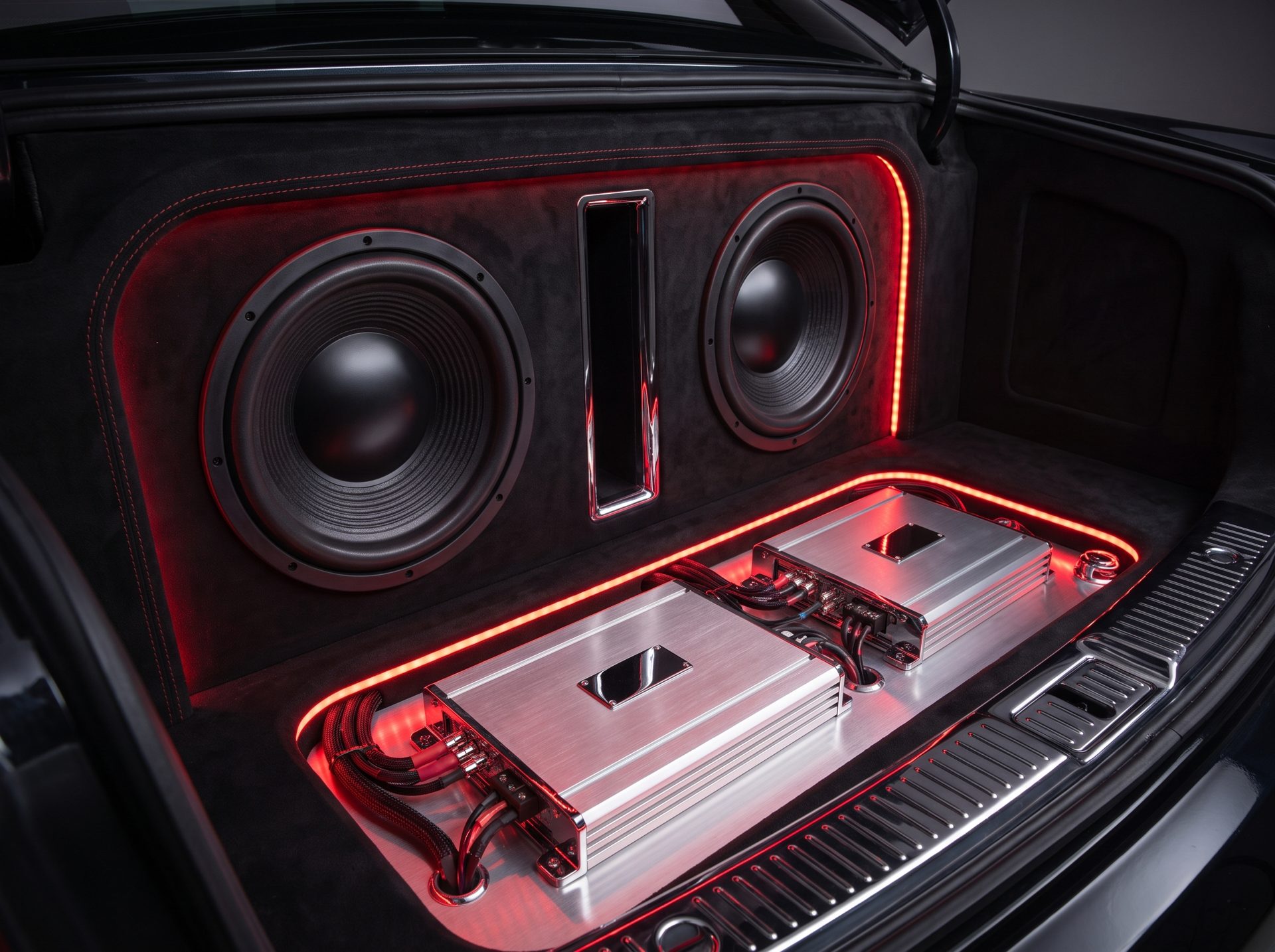Dual 12-inch subwoofers in a suede trunk enclosure